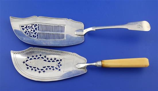 A George III ivory handled silver fish slice and an early Victorian Scottish silver fish slice, gross 7 oz.